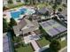 An aerial view of community amenities including a pool, clubhouse, and tennis courts at 124 Oat Grain Ct, Clayton, NC 27520