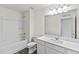 Bathroom featuring a combination tub and shower, white vanity, and ample space at 124 Oat Grain Ct, Clayton, NC 27520