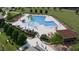 The community features a resort-style pool with a water slide, seating areas, and well-maintained landscaping at 128 Oat Grain Ct, Clayton, NC 27520