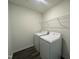 Efficient laundry room features a wire shelf for extra storage, plus new washer and dryer at 128 Oat Grain Ct, Clayton, NC 27520