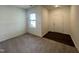 Cozy living room features neutral carpet, window letting in natural light, and an entryway at 128 Oat Grain Ct, Clayton, NC 27520