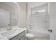 Clean bathroom featuring a single sink vanity, tub and shower combo, and new fixtures at 1811 Parham Dr, Graham, NC 27253