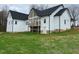 Backyard view of a charming farmhouse with a balcony at 187 Dairymont Dr, Pittsboro, NC 27312
