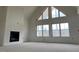 Elegant living room with a fireplace and bright, well-lit windows at 187 Dairymont Dr, Pittsboro, NC 27312