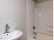 Bright bathroom featuring a shower-tub combo and single sink at 200 Pace St, Smithfield, NC 27577