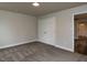 Bedroom features closet and doorway to the rest of the home and neutral colored carpet at 200 Pace St, Smithfield, NC 27577