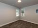 Cozy bedroom featuring neutral-toned walls, plush carpeting, and well-lit windows at 200 Pace St, Smithfield, NC 27577