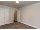 Bedroom featuring closet and door to other rooms, neutral carpeting, and natural light at 200 Pace St, Smithfield, NC 27577