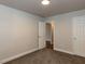 Bedroom featuring plush carpet, neutral walls, and view into another room at 200 Pace St, Smithfield, NC 27577