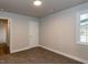 Comfortable bedroom featuring plush carpeting, neutral-toned walls, and a bright window at 200 Pace St, Smithfield, NC 27577