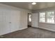 Spacious bedroom features carpet, natural light, and double door closet for plenty of storage at 200 Pace St, Smithfield, NC 27577