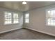 Bedroom featuring two windows providing great natural light and neutral carpeting at 200 Pace St, Smithfield, NC 27577