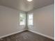 Bedroom features two windows providing great natural light and neutral carpeting at 200 Pace St, Smithfield, NC 27577