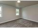 Cozy bedroom with neutral carpeting, soothing paint color, and natural light from windows at 200 Pace St, Smithfield, NC 27577