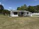 Charming single story home featuring a quaint front porch and manicured lawn at 200 Pace St, Smithfield, NC 27577