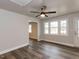 Living room area with hard wood floors, a ceiling fan, neutral walls and large windows at 200 Pace St, Smithfield, NC 27577