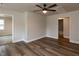 A living room featuring hardwood flooring, ceiling fan, and neutral colored walls at 200 Pace St, Smithfield, NC 27577