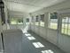 Bright, sun-filled sunroom with multiple windows offering great natural light and outdoor views at 200 Pace St, Smithfield, NC 27577