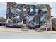 Exterior view of building with a vibrant mural of birds, flowers, and the word 'Garner' at 200 Rand Mill Rd, Garner, NC 27529