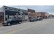 Street view of several businesses, including Shady's, with parked cars and street markings at 200 Rand Mill Rd, Garner, NC 27529