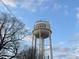 View of Historic Downtown Garner water tower against a blue sky with some tree branches at 200 Rand Mill Rd, Garner, NC 27529