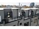 Aerial view of condo rooftops with skyline in the distance at 2000 Moody Ln, Durham, NC 27701