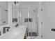 Modern bathroom with double vanity, glass-enclosed shower, and sleek fixtures at 2000 Moody Ln, Durham, NC 27701
