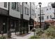 Row of townhomes with gray siding, black accents, landscaping, and walkways at 2000 Moody Ln, Durham, NC 27701