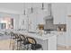 Modern kitchen with a central island, stainless steel appliances, and an open layout leading to a comfortable living area at 2000 Moody Ln, Durham, NC 27701