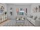 Stylish living room with a comfortable sofa, patterned rug, and ample natural light, creating an inviting atmosphere at 2000 Moody Ln, Durham, NC 27701