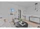 Cozy living room featuring an open floor plan, neutral decor, and a view of the bathroom at 2000 Moody Ln, Durham, NC 27701