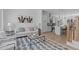 Bright living room featuring modern decor, hardwood floors, and an open floor plan to the kitchen at 2000 Moody Ln, Durham, NC 27701