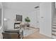 Bright office space featuring light hardwood floors, modern desk, rug, and decor at 2000 Moody Ln, Durham, NC 27701