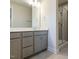 This bathroom features gray cabinets, chrome hardware, quartz counters, and a glass enclosed shower at 2015 Trident Maple Ln, Chapel Hill, NC 27517