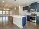 The kitchen features a large island, stainless steel appliances, and plenty of countertop space at 2015 Trident Maple Ln, Chapel Hill, NC 27517