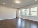 Living room featuring hardwood floors, recessed lights, and back patio access at 2015 Trident Maple Ln, Chapel Hill, NC 27517