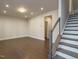 Open concept living room with hardwood floors, recessed lighting, and staircase at 2015 Trident Maple Ln, Chapel Hill, NC 27517