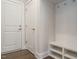 Bright mudroom with storage bench, coat hooks, and neutral paint at 2015 Trident Maple Ln, Chapel Hill, NC 27517