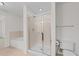 Neutral bathroom featuring a separate glass shower and tub, toilet and a tile floor at 222 Glenwood Ave # 608, Raleigh, NC 27603