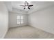 Empty bedroom with neutral carpet, white walls, and a window providing natural light at 222 Glenwood Ave # 608, Raleigh, NC 27603