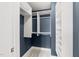 Closet featuring a carpeted floor and built-in shelving for optimal storage at 222 Glenwood Ave # 608, Raleigh, NC 27603