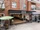 Welcoming entrance with brick accents and outdoor dining at 222 Glenwood Ave # 608, Raleigh, NC 27603