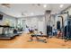Community gym with various exercise equipment and natural light at 222 Glenwood Ave # 608, Raleigh, NC 27603