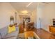 Open-concept living room with modern decor, wood floors, dining area, and a view into the kitchen at 222 Glenwood Ave # 608, Raleigh, NC 27603