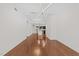 Spacious living room with hardwood floors, modern lighting, and open view to the kitchen and dining area at 222 Glenwood Ave # 608, Raleigh, NC 27603