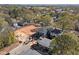 Aerial view of a new construction home with a dark roof, situated in a leafy neighborhood with nearby city skyline at 2305 Turners Aly, Raleigh, NC 27607