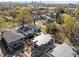 New construction home featuring a dark roof and modern design, nestled in a neighborhood surrounded by mature trees at 2305 Turners Aly, Raleigh, NC 27607