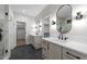 Bathroom with double vanities with marble countertops, modern fixtures, and walk-in closets at 2305 Turners Aly, Raleigh, NC 27607