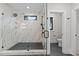 Bathroom boasts a glass enclosed shower featuring a rain shower head and stone tile surround at 2305 Turners Aly, Raleigh, NC 27607