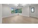 The bedroom has lots of natural light from large windows and a modern light fixture at 2305 Turners Aly, Raleigh, NC 27607